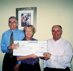 Lynn presents a cheque to ME Research UK